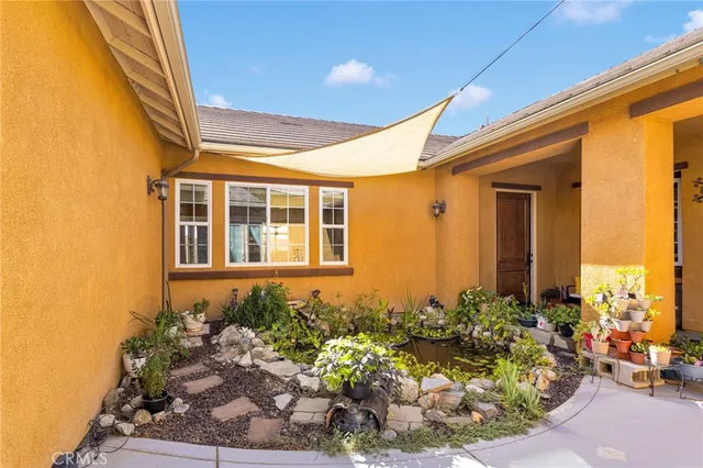 a front view of a house with outdoor seating