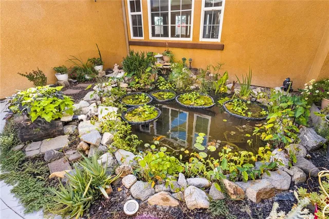 a view of a dining room with furniture wooden floor and chandelier