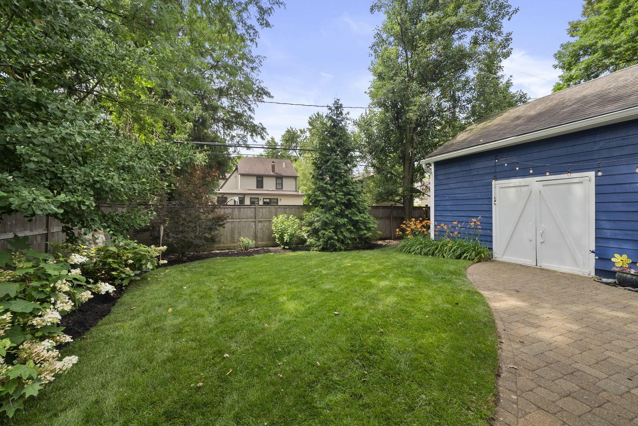 1851 Berkshire Road Columbus, OH 43221 - Photo 93 of 125 Backyard, elegant landscaping and access to garage.