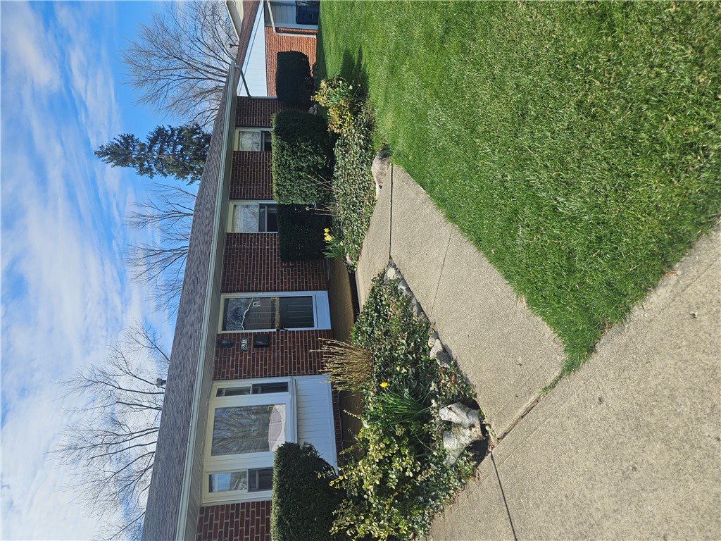 6510 Longford Road Dayton, OH 45424 - Photo 3 of 27 This classic brick residence boasts a neatly manicured lawn and inviting pathways.