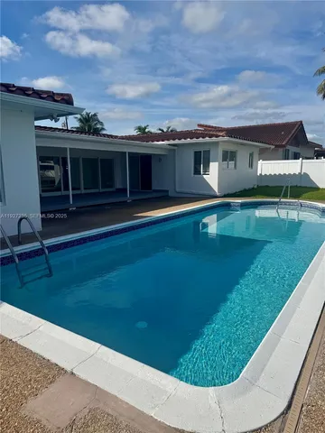 a front view of a house with swimming pool