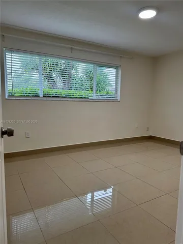 a view of a room with a large window