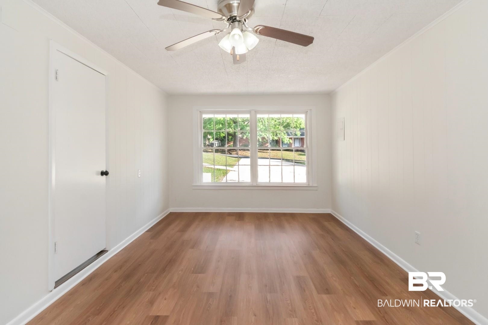 115 Pineridge Road Daphne, AL 36526 - Photo 17 of 34 Spare room featuring baseboards, a ceiling fan, and wood finished floors