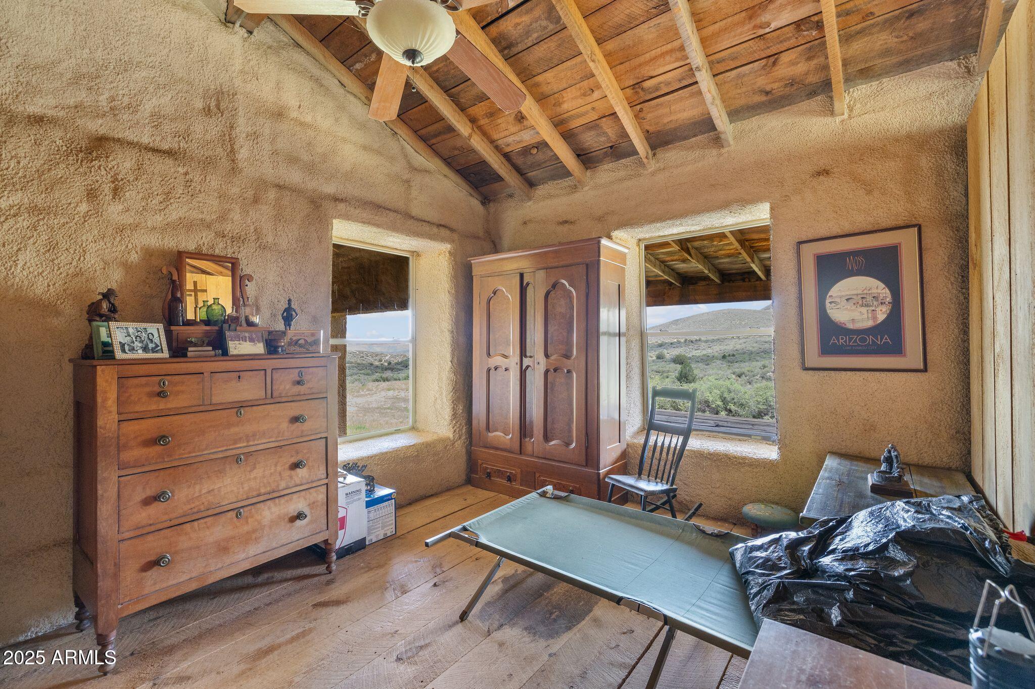 9955 East Iron King Road Mayer, AZ 86333 - Photo 17 of 41 a living room with furniture and a window