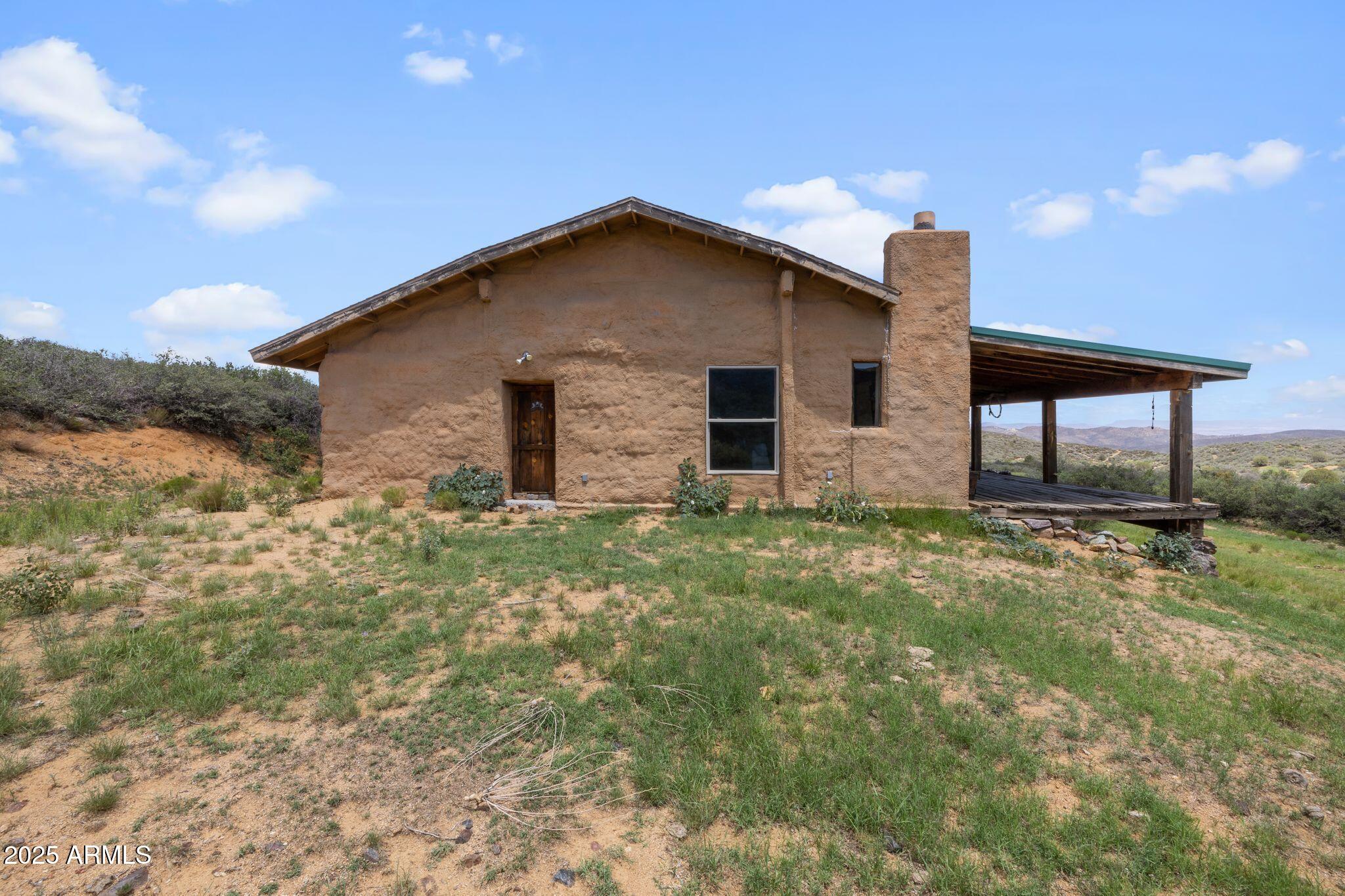 9955 East Iron King Road Mayer, AZ 86333 - Photo 23 of 41 a house view with a backyard space