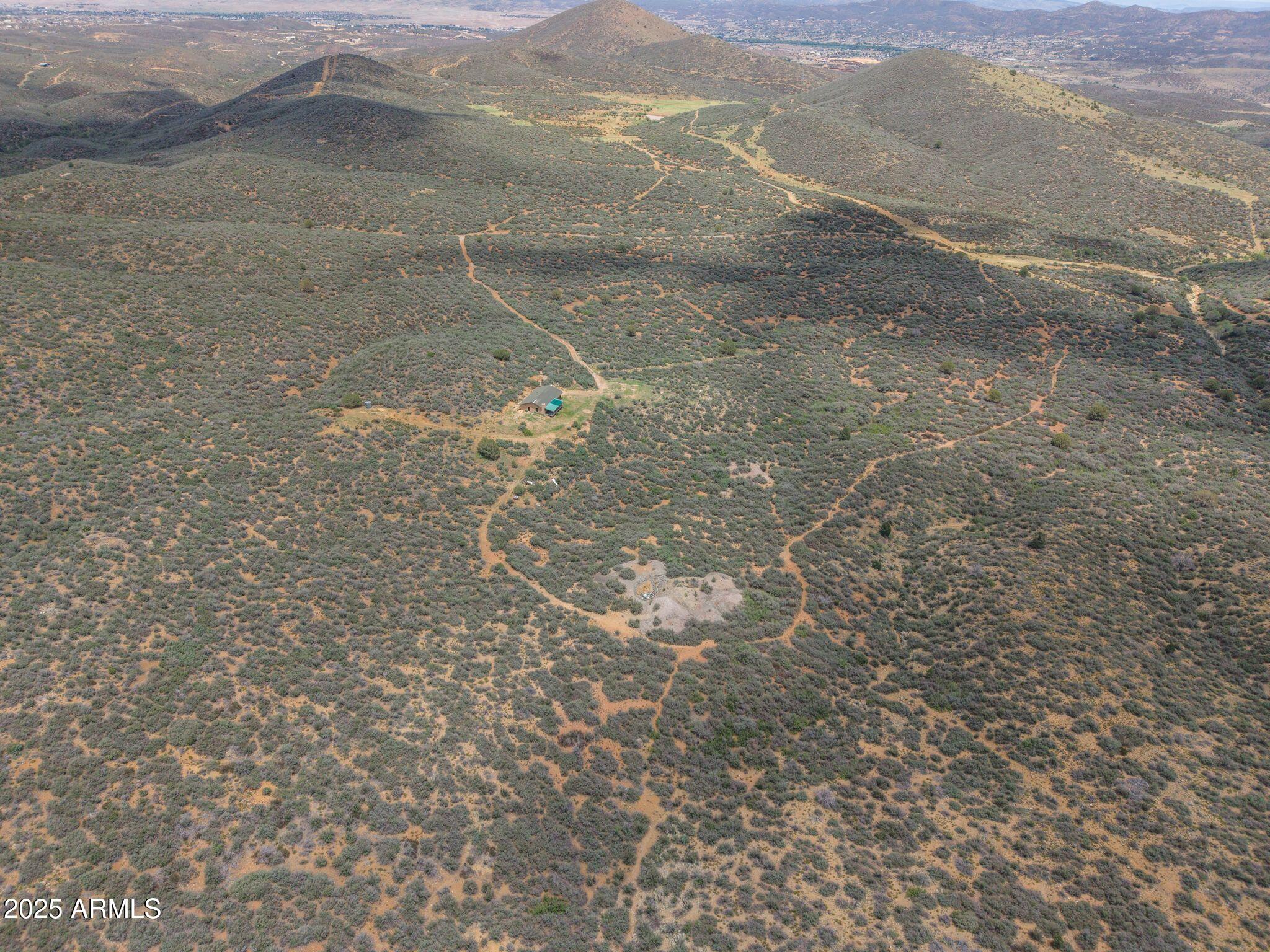 9955 East Iron King Road Mayer, AZ 86333 - Photo 25 of 41 a view of a yard with a mountain