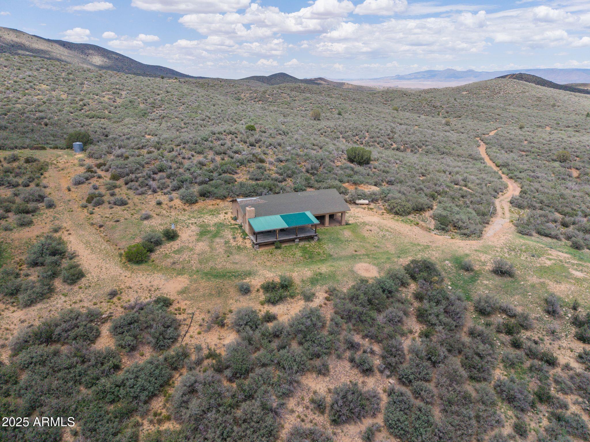 9955 East Iron King Road Mayer, AZ 86333 - Photo 27 of 41 a view of a dry field with mountains in the background