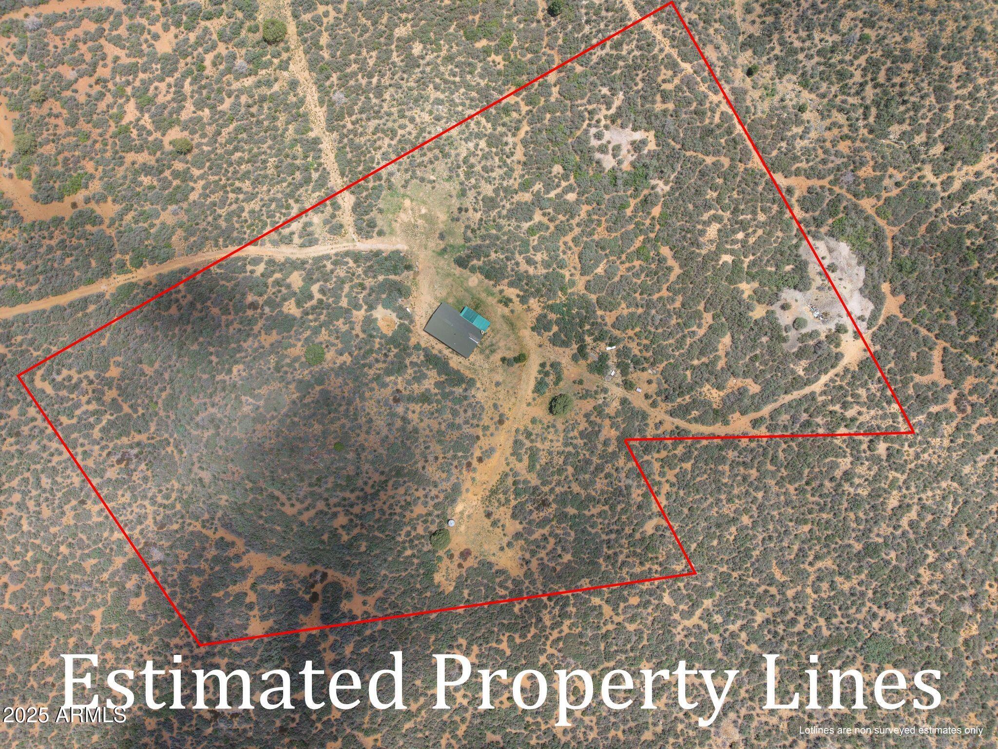 9955 East Iron King Road Mayer, AZ 86333 - Photo 32 of 41 a black and white photo of a house