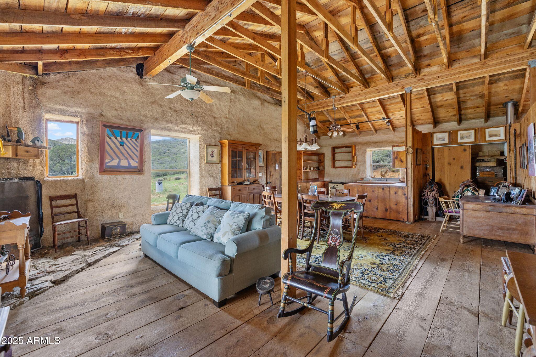9955 East Iron King Road Mayer, AZ 86333 - Photo 8 of 41 a living room with furniture and a wooden floor
