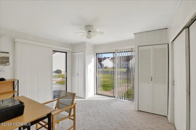a view of a livingroom with furniture and a window
