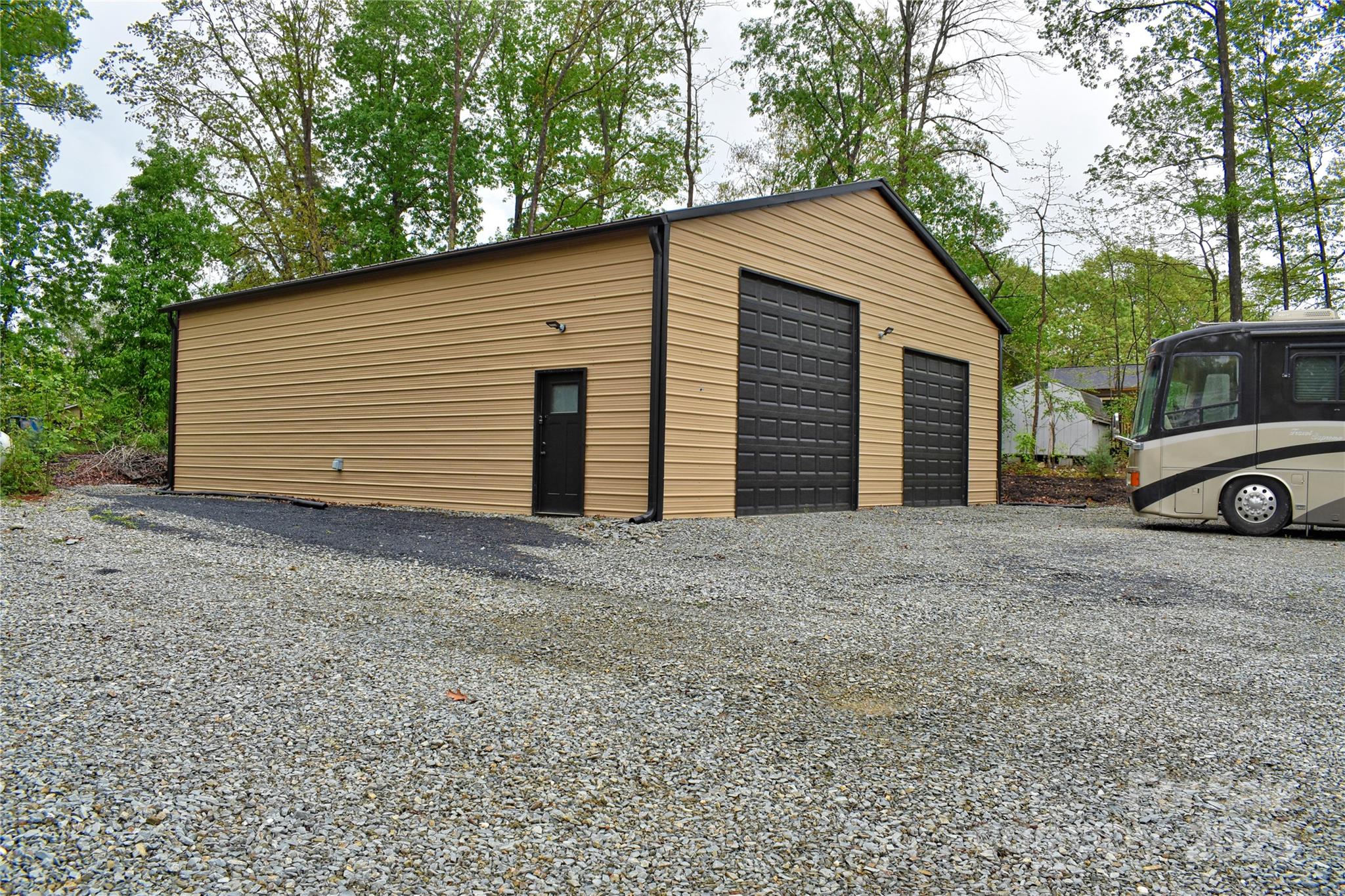482 Old Camp Road Denton, NC 27239 - Photo 2 of 48 a view of a house with a yard and garage