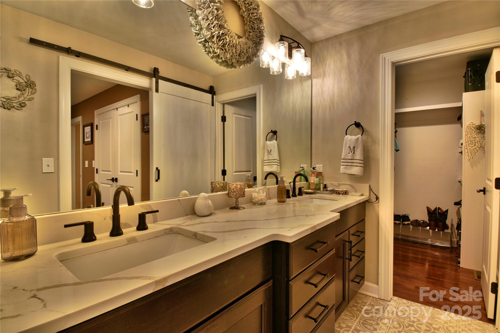 482 Old Camp Road Denton, NC 27239 - Photo 32 of 48 a bathroom with a double vanity sink and a mirror