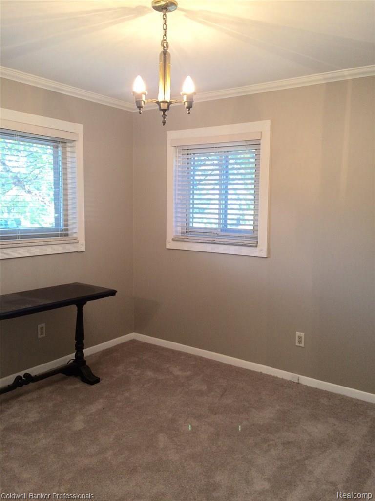 868 North Adams Road, Unit 37 Birmingham, MI 48009 - Photo 10 of 23 bedroom 2 w table.jpg