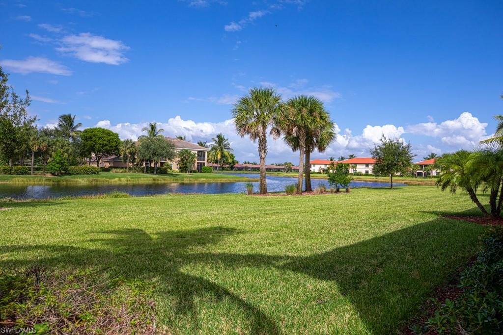 3161 Aviamar Circle, Unit 101 Naples, FL 34114 - Photo 18 of 32 a view of a garden with houses