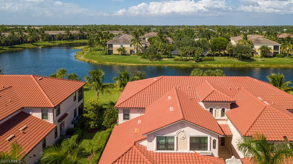 3161 Aviamar Circle, Unit 101 Naples, FL 34114 - Photo 23 of 32 an aerial view of a house with a lake view