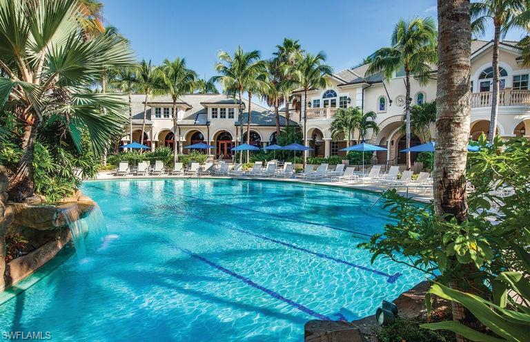 3161 Aviamar Circle, Unit 101 Naples, FL 34114 - Photo 27 of 32 a front view of building with yard