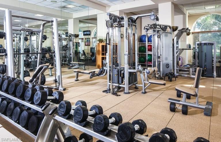 3161 Aviamar Circle, Unit 101 Naples, FL 34114 - Photo 29 of 32 a view of a room with gym equipment