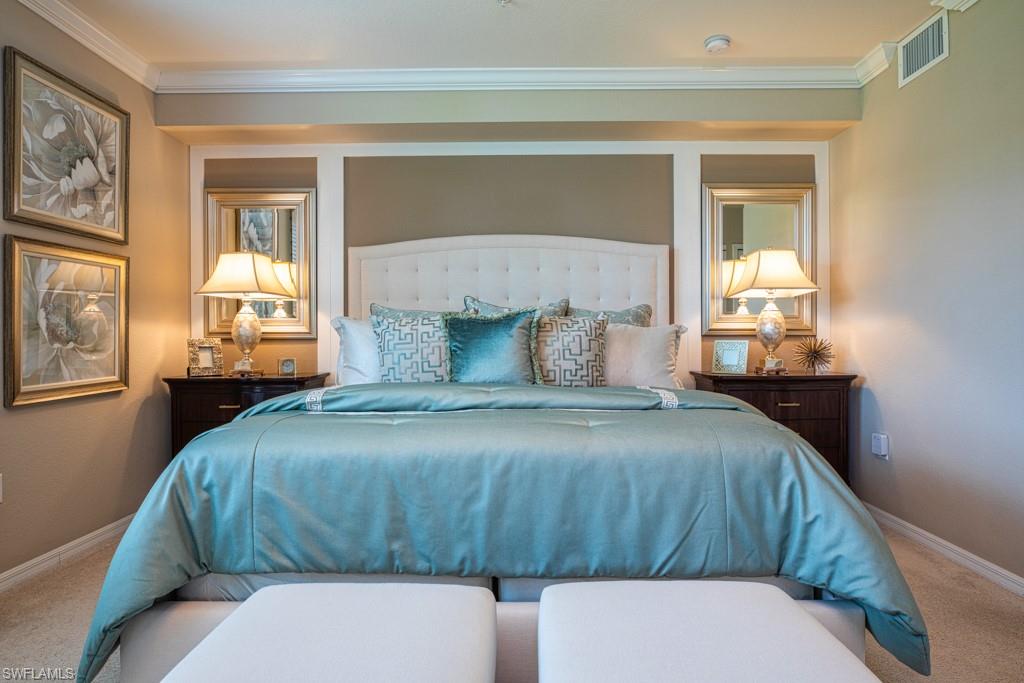 3161 Aviamar Circle, Unit 101 Naples, FL 34114 - Photo 6 of 32 a bedroom with a bed and window