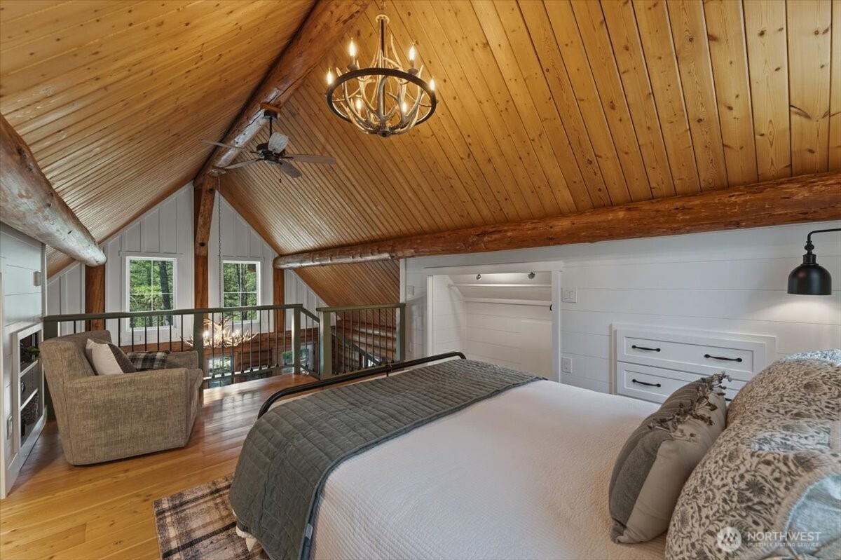2350 First Crk Road Chelan, WA 98816 - Photo 24 of 39 a bedroom with a bed and ceiling fan