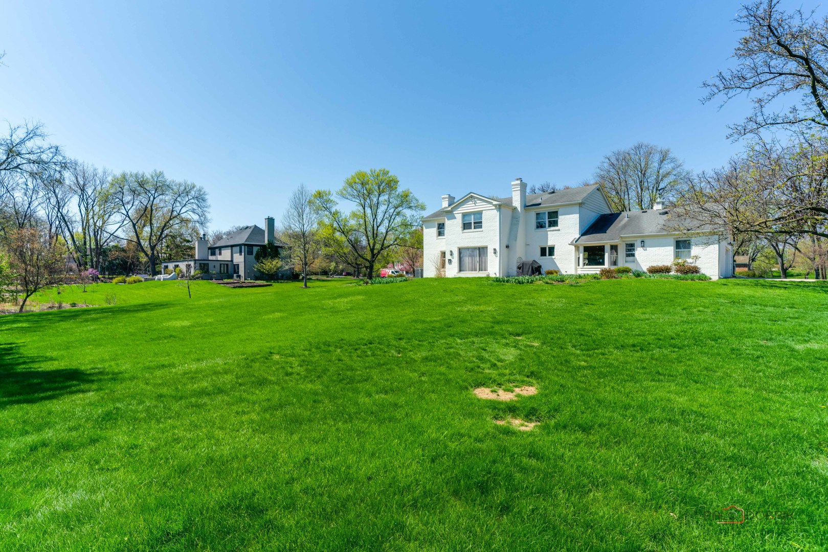 37 Forest Hills Road Lake Bluff, IL 60044 - Photo 44 of 52 a view of a house with a big yard