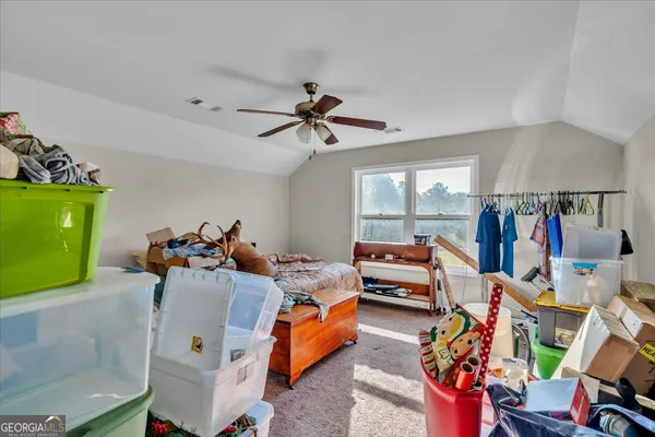 a bed room with furniture and a window