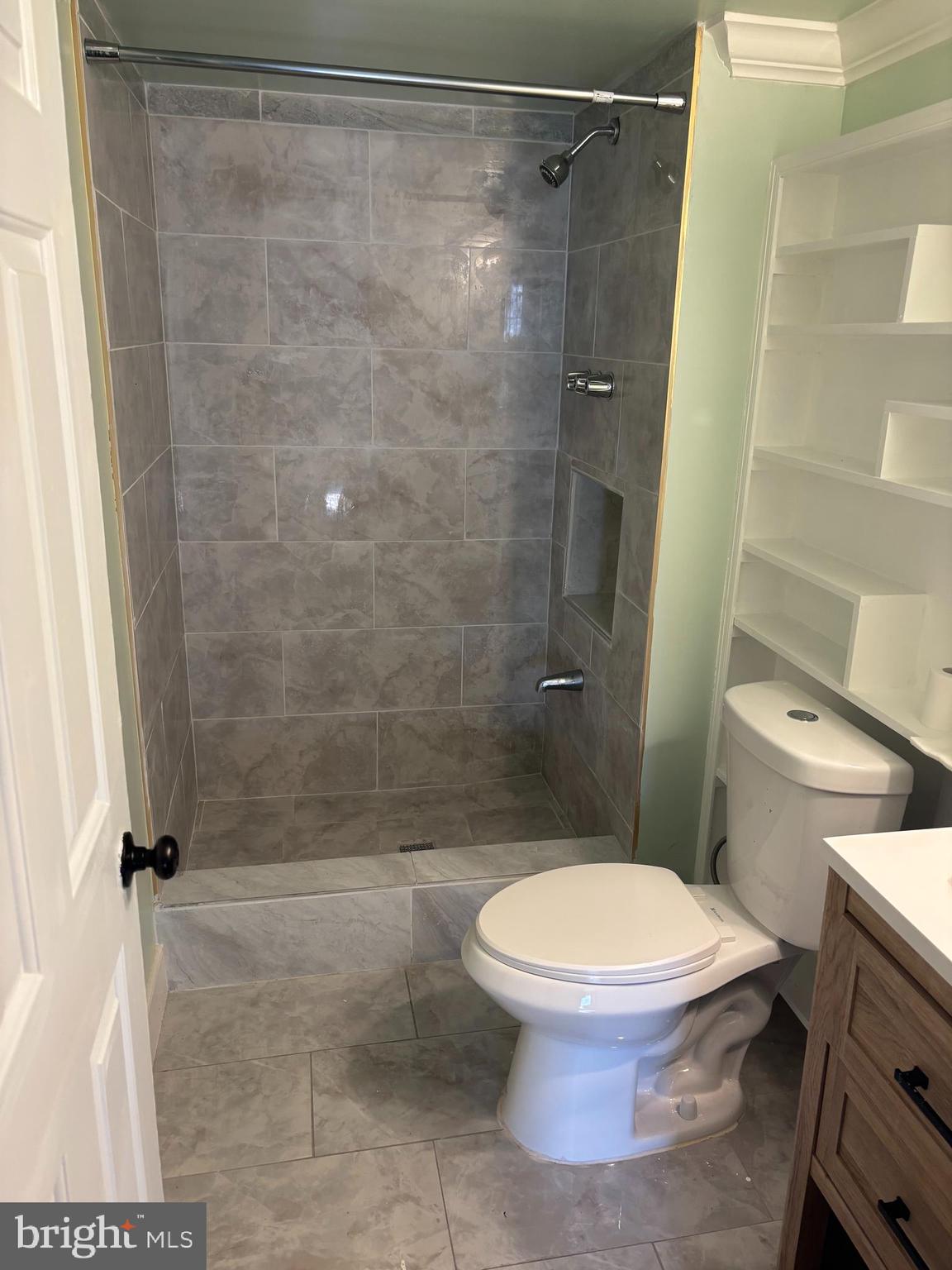 6610 Central Avenue Capitol Heights, MD 20743 - Photo 6 of 9 a bathroom with a toilet and a shower