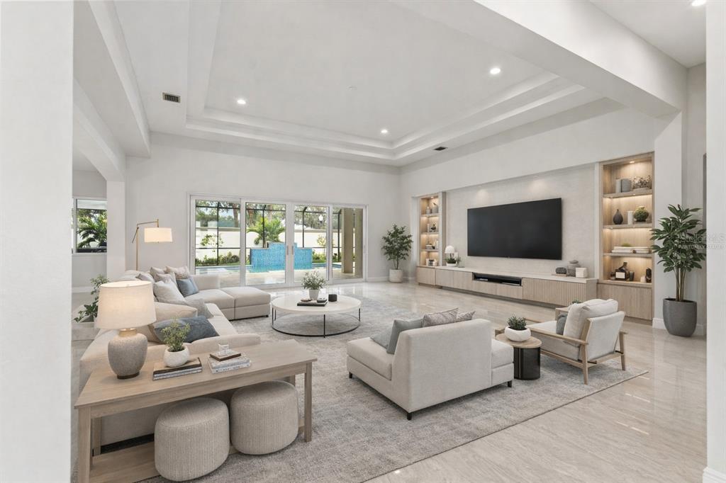 10700 Pontofino Circle Trinity, FL 34655 - Photo 14 of 99 a living room with furniture and a flat screen tv