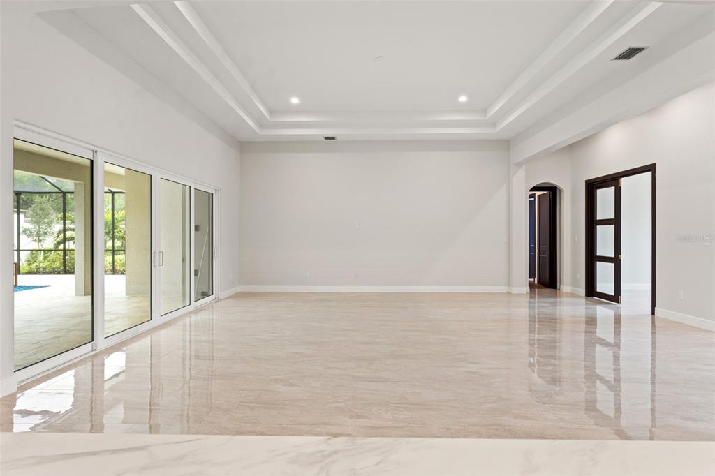10700 Pontofino Circle Trinity, FL 34655 - Photo 26 of 99 a view of an empty room with glass door