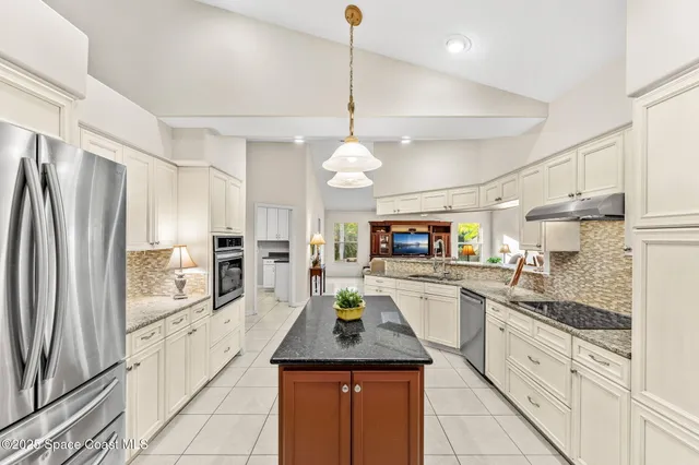 a view of a workspace with furniture and a potted plant