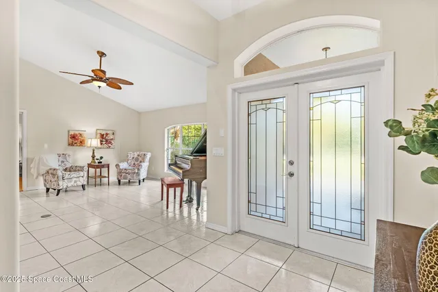 a view of a house with a yard and garage
