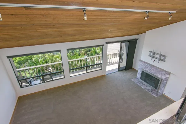 a kitchen with granite countertop a sink and a large window