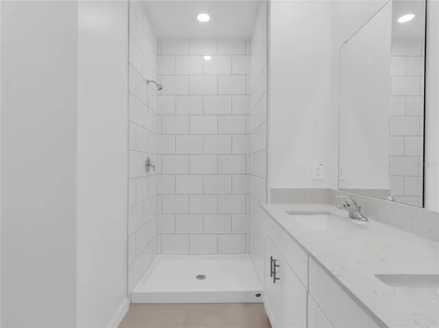 a bathroom with a sink and shower