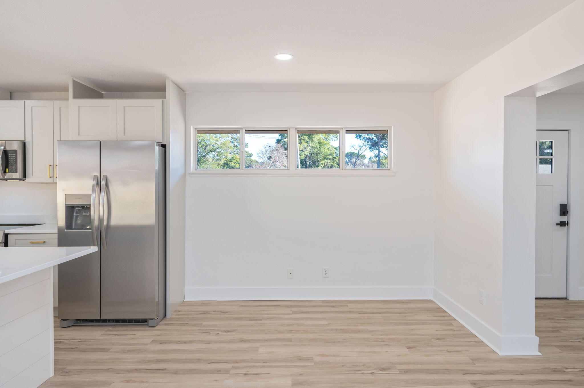 118 Ferry Road Northeast Fort Walton Beach, FL 32548 - Photo 12 of 51 a view of kitchen with wooden floor electronic appliances and window
