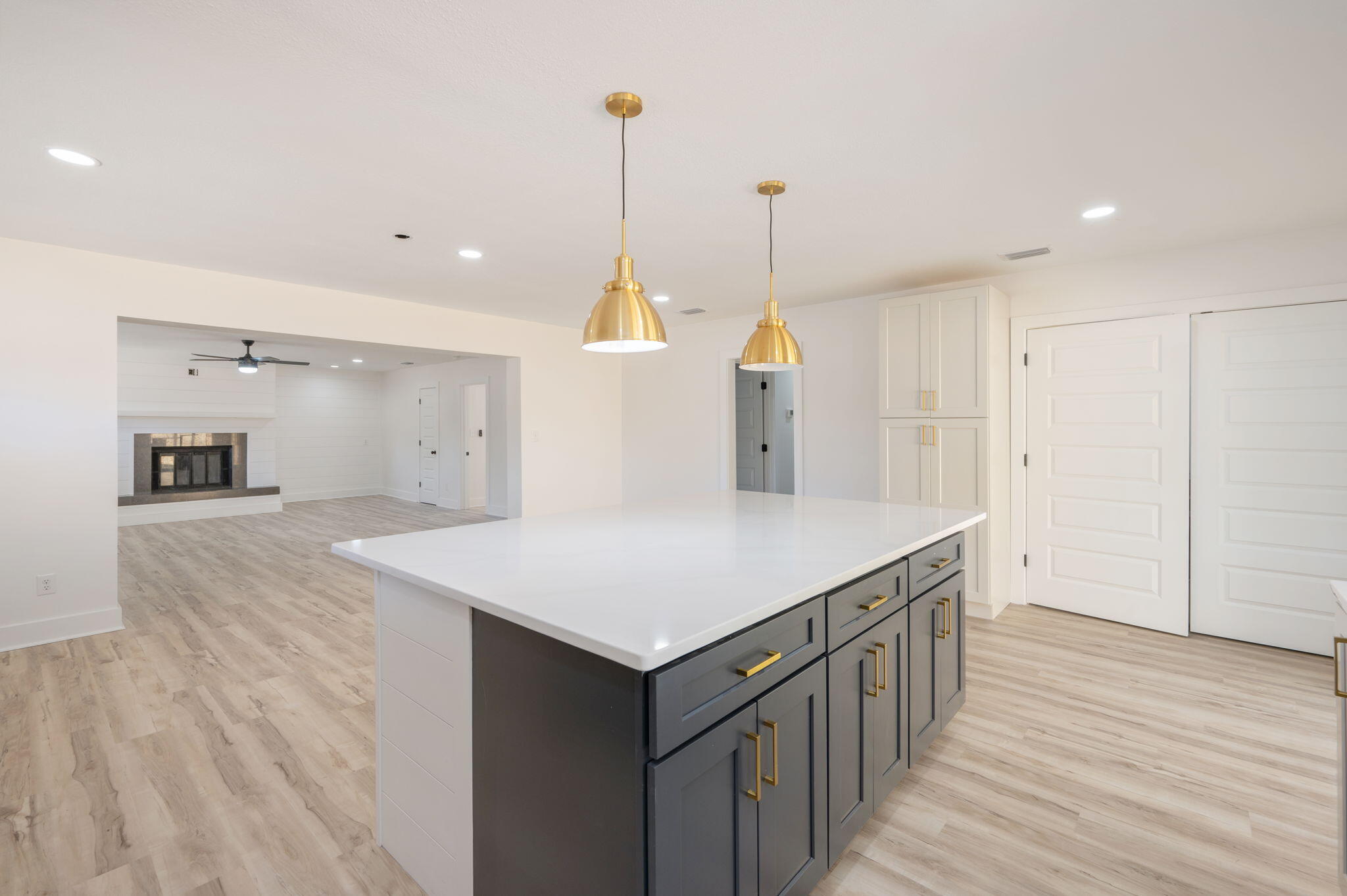 118 Ferry Road Northeast Fort Walton Beach, FL 32548 - Photo 16 of 51 a kitchen with a sink a refrigerator and wooden floor