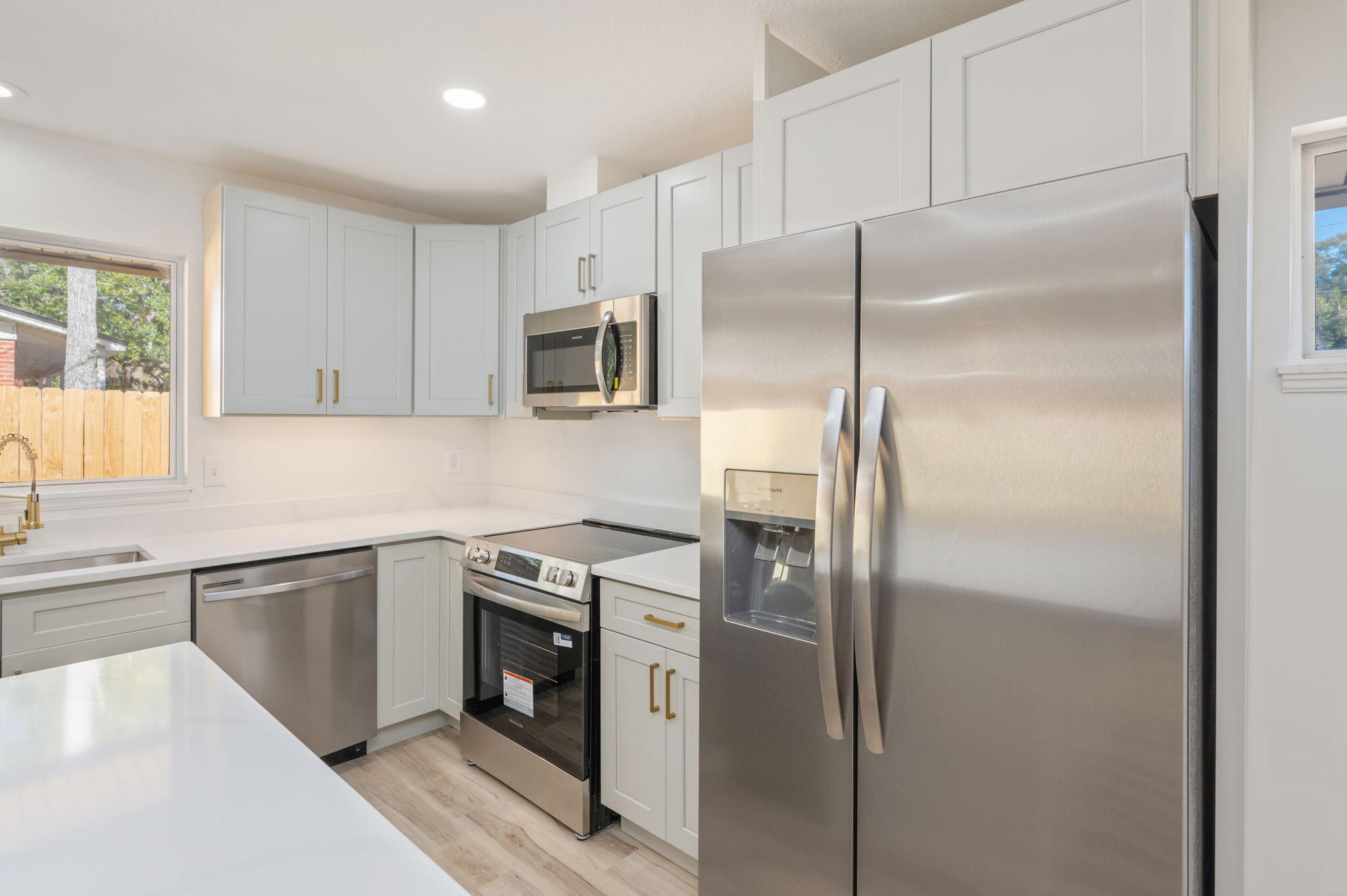 118 Ferry Road Northeast Fort Walton Beach, FL 32548 - Photo 17 of 51 a kitchen with stainless steel appliances granite countertop a refrigerator and a sink