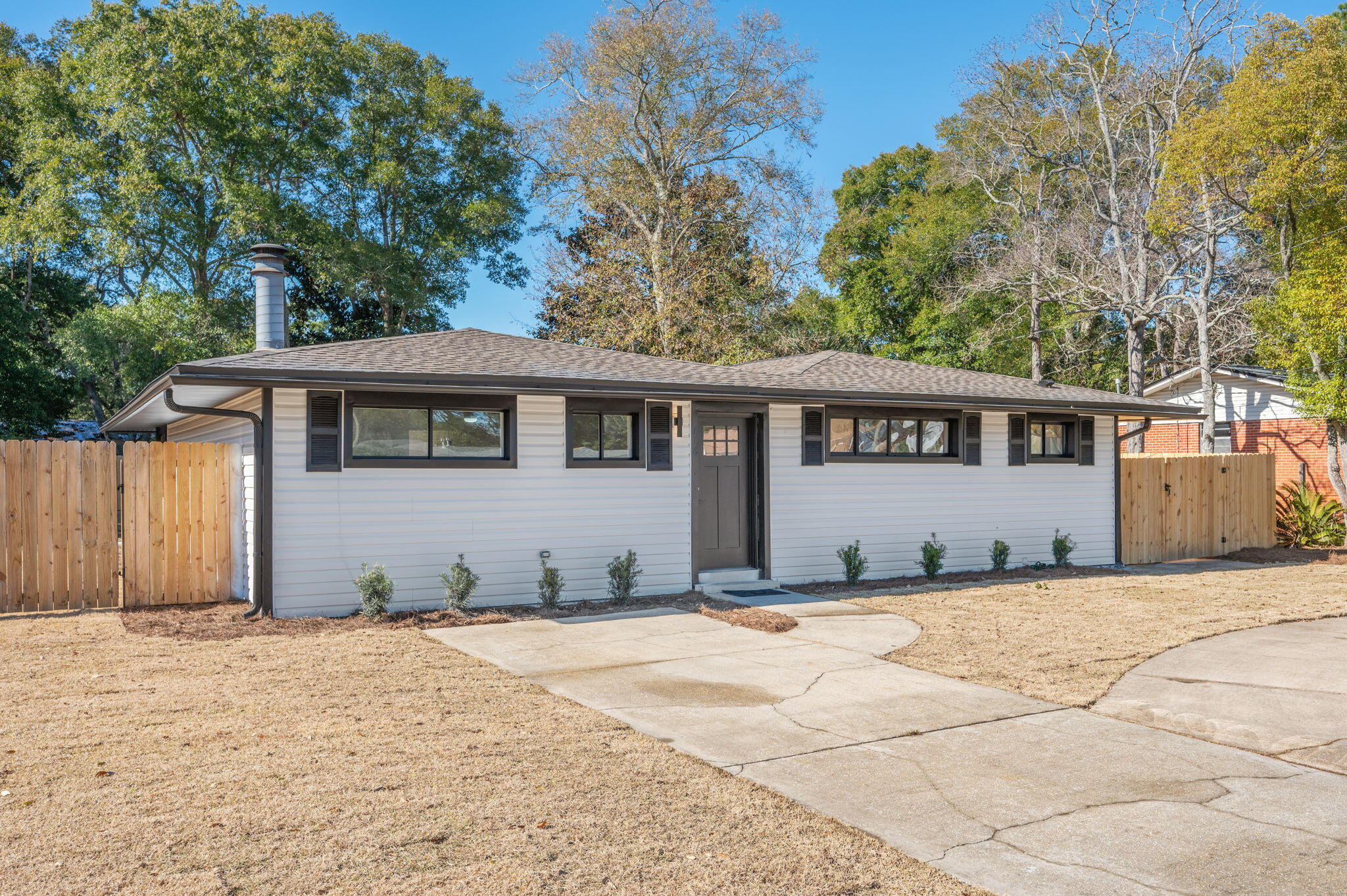 118 Ferry Road Northeast Fort Walton Beach, FL 32548 - Photo 2 of 51 a front view of a house with a yard