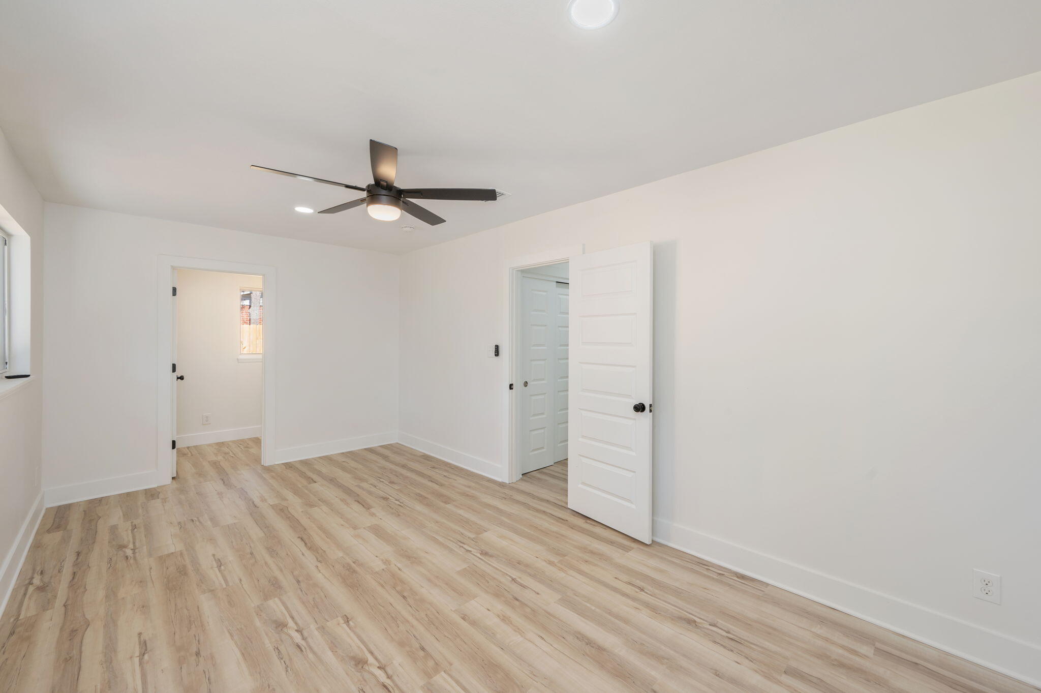 118 Ferry Road Northeast Fort Walton Beach, FL 32548 - Photo 21 of 51 an empty room with a ceiling fan and wooden floor
