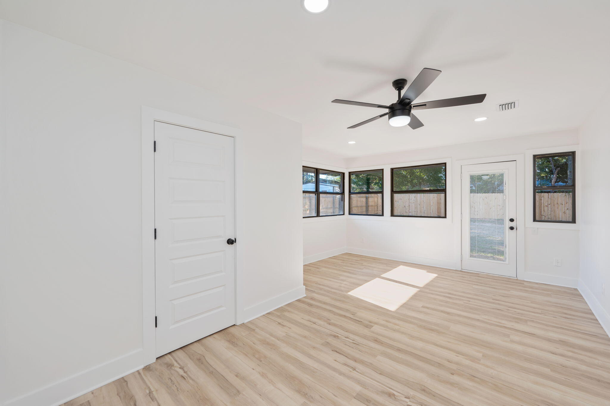 118 Ferry Road Northeast Fort Walton Beach, FL 32548 - Photo 30 of 51 wooden floor in an empty room with a window