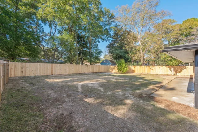a view of backyard with green space