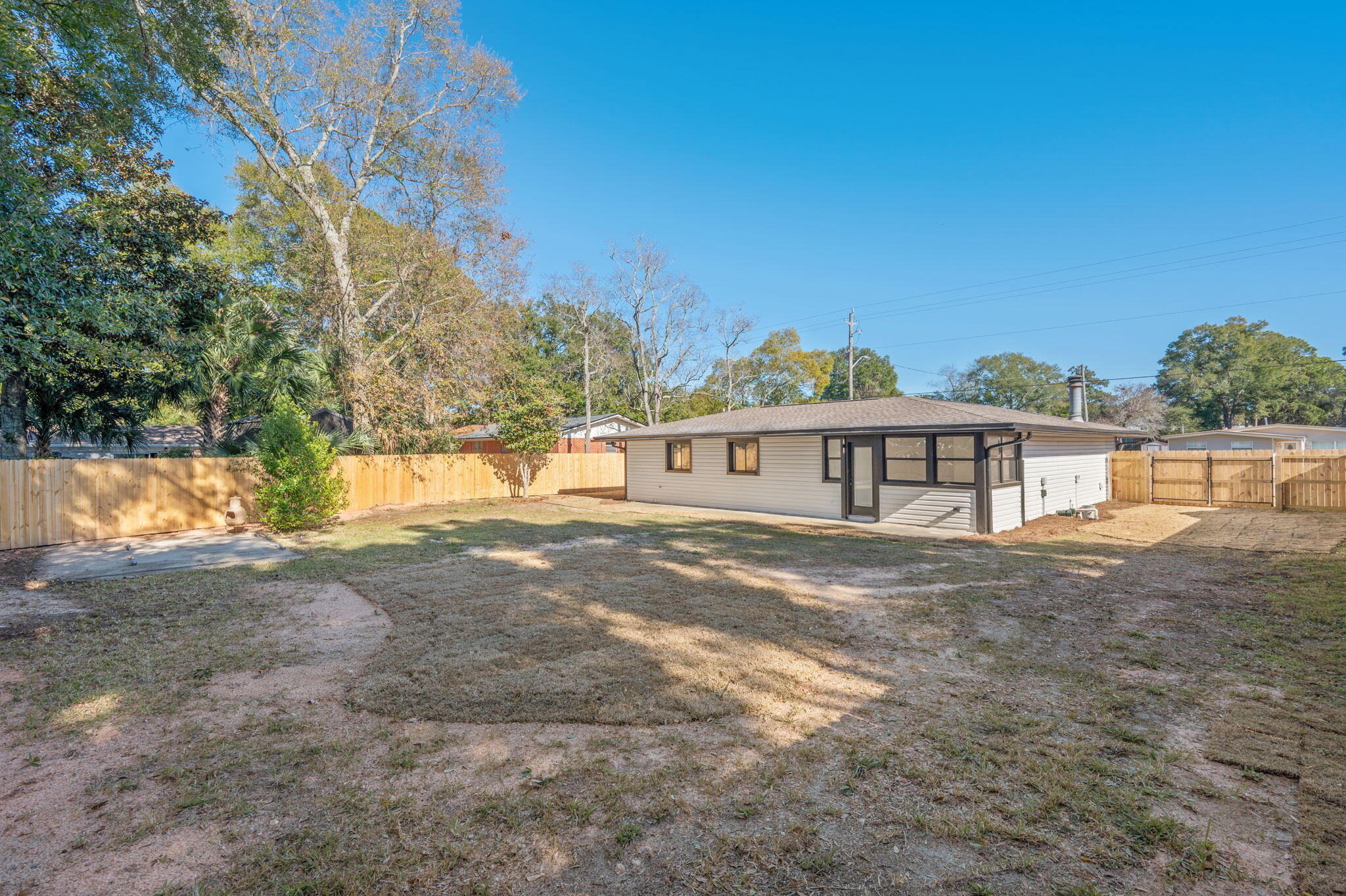 118 Ferry Road Northeast Fort Walton Beach, FL 32548 - Photo 34 of 51 a view of a yard in front of a house with large trees