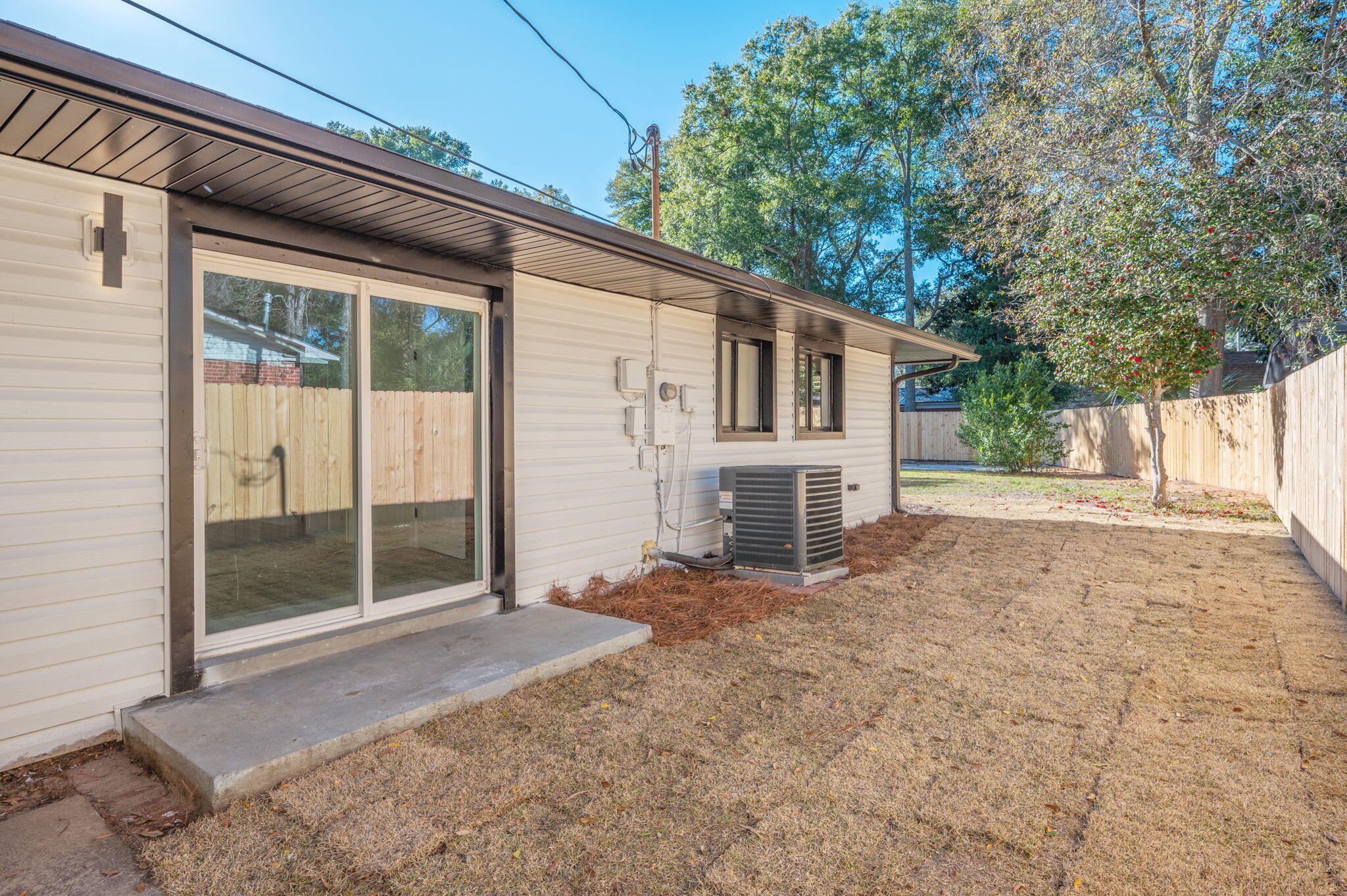 118 Ferry Road Northeast Fort Walton Beach, FL 32548 - Photo 37 of 51 a view of house with backyard and glass windows