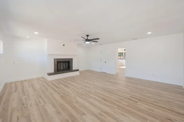 a living room with fireplace furniture and a flat screen tv
