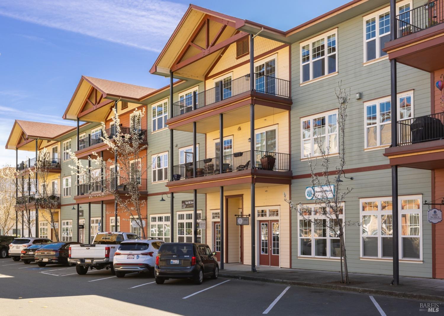 198 Johnson Street Windsor, CA 95492 - Photo 1 of 1 a city street lined with parked cars front of buildings