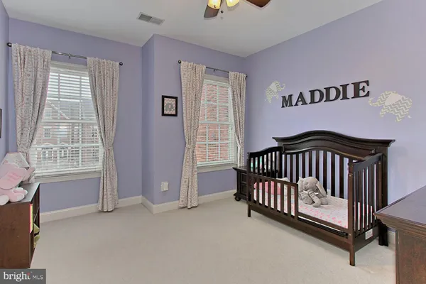 a bedroom with a bed and a chair