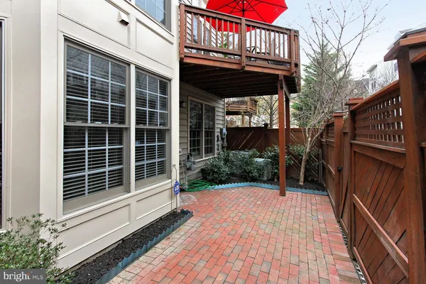 a wooden bench sitting in front of a building