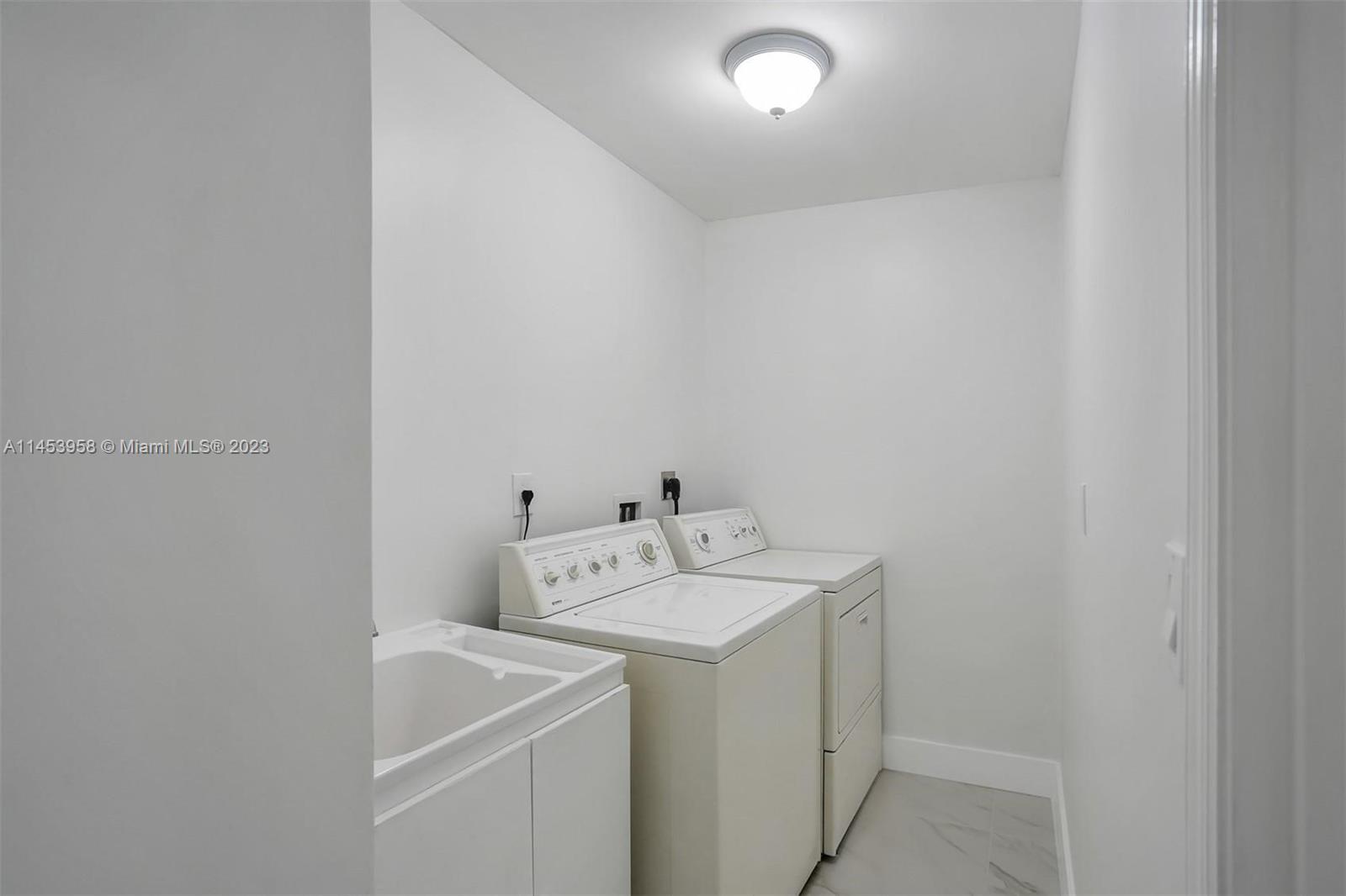 3012 Elizabeth Street, Unit 3012 Miami, FL 33133 - Photo 20 of 27 a utility room with dryer and washer