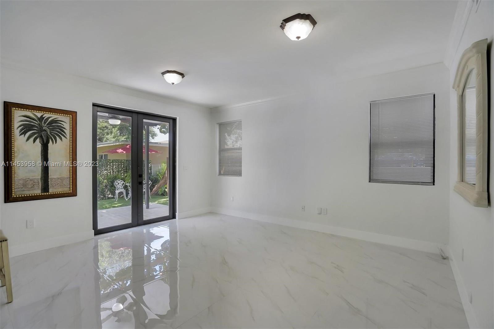 3012 Elizabeth Street, Unit 3012 Miami, FL 33133 - Photo 21 of 27 wooden floor in an empty room with a window