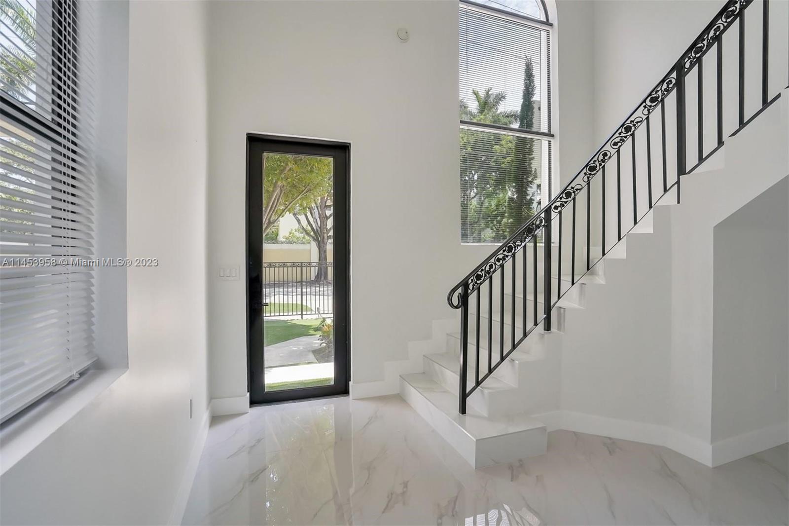 3012 Elizabeth Street, Unit 3012 Miami, FL 33133 - Photo 8 of 27 a view interior of a house with wooden floor windows and stairs