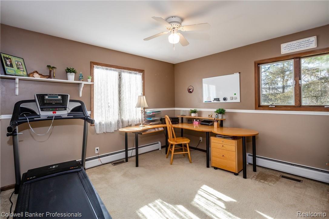 4777 Six Mile Road South Lyon, MI 48178 - Photo 42 of 71 Bedroom 2, currently used as an office has south and west windows