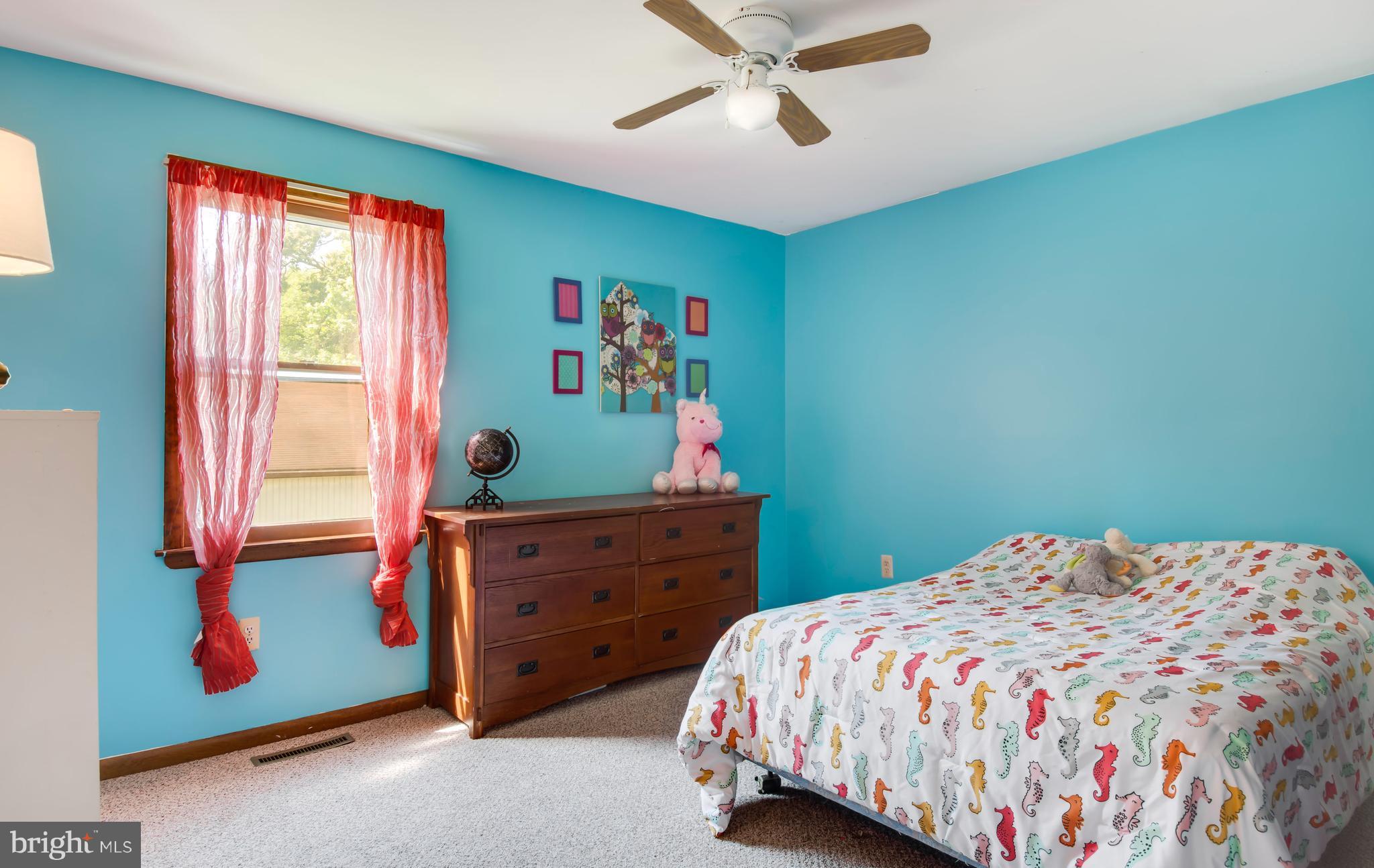 1831 Potomac Road Edgewater, MD 21037 - Photo 13 of 27 a bedroom with a bed and a window